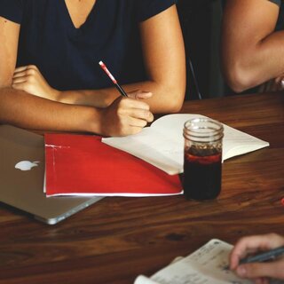 Colleagues reviewing plans together at a desk
