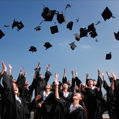 Graduates throwing their caps in celebration