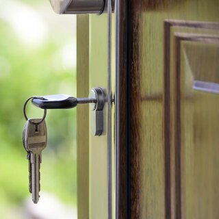 House keys in the door of a new home
